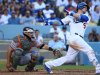 Yasmani Grandal apalea a Gigantes de San Francisco